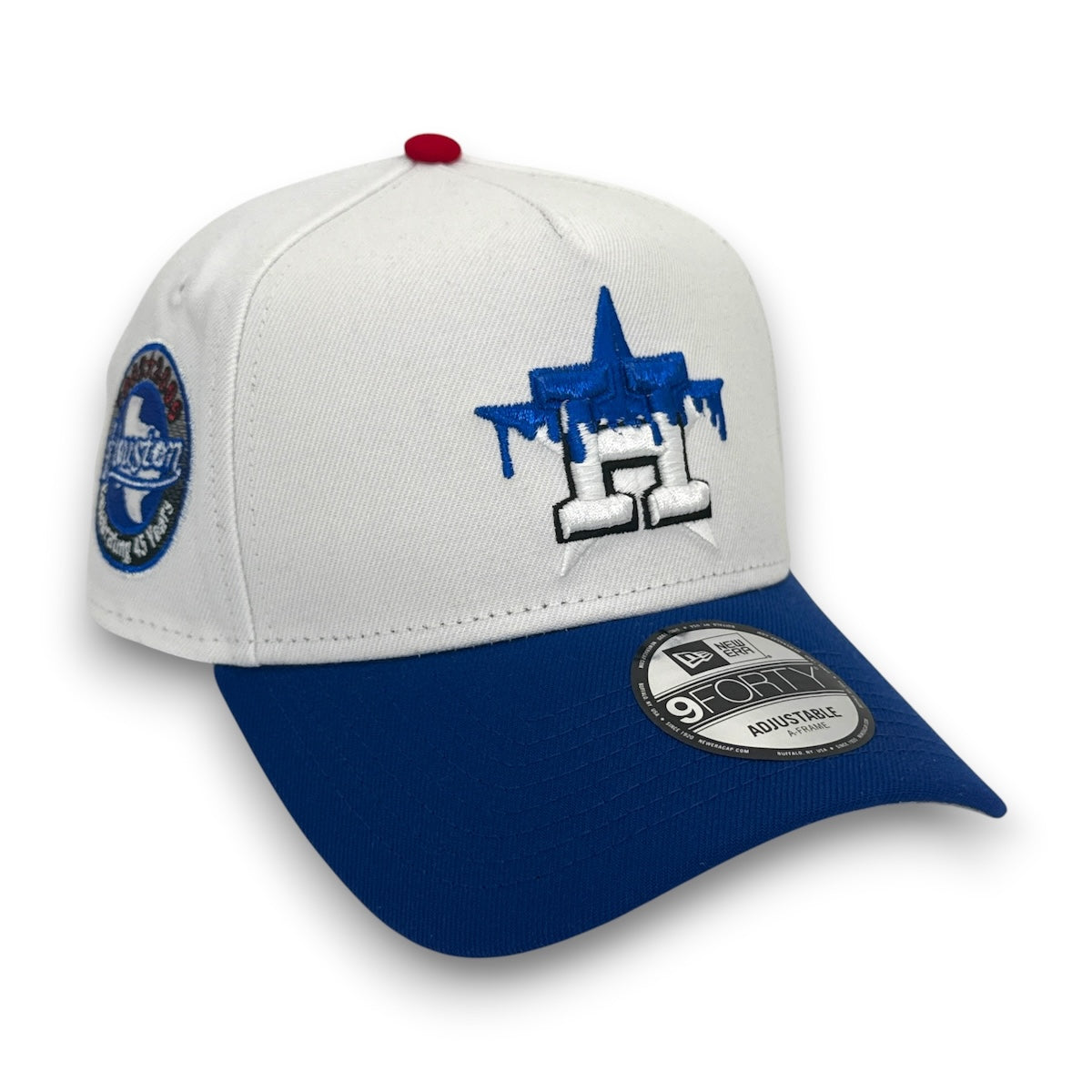 White and blue cap with embroidered designs on a white background