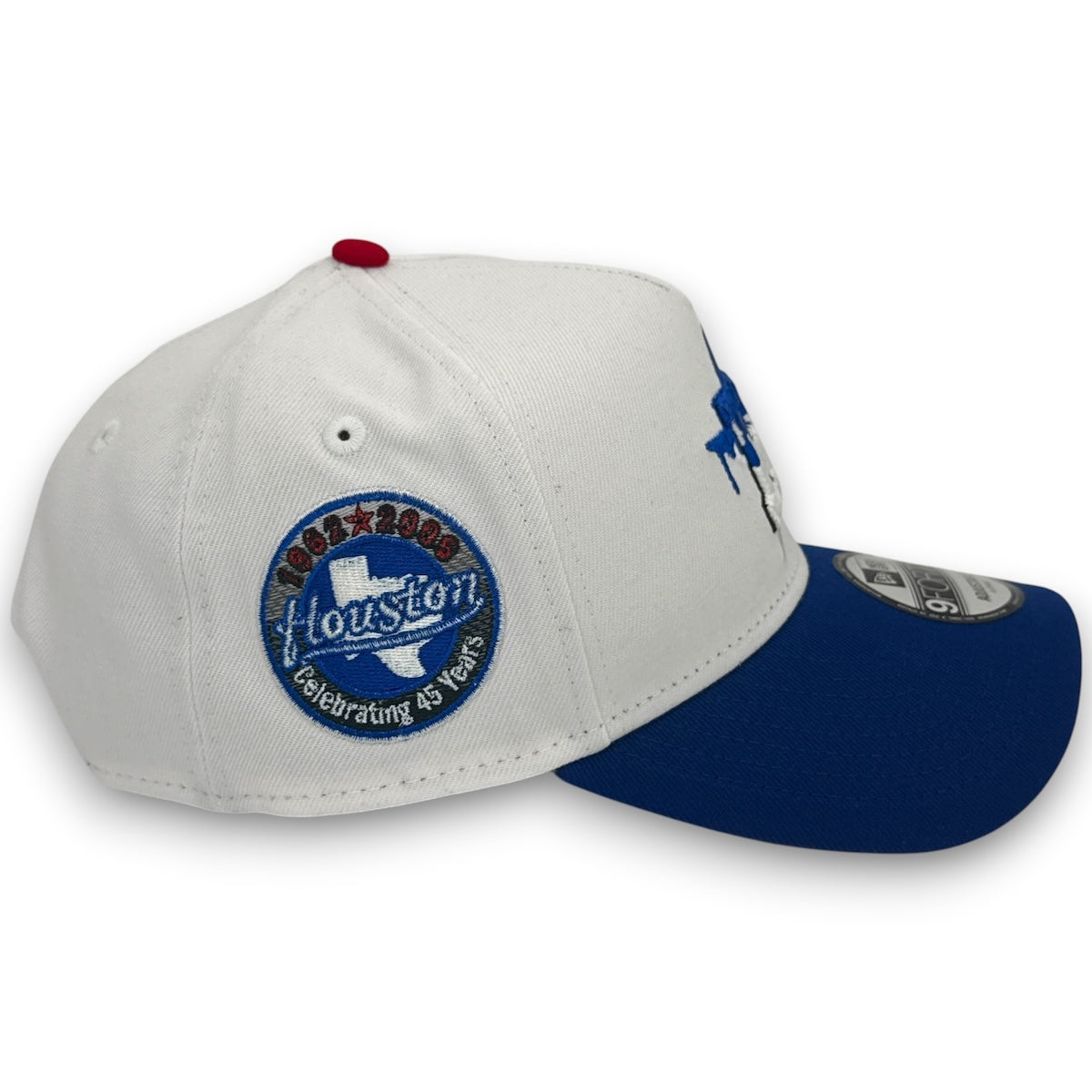 White and blue cap with Houston logo on a white background