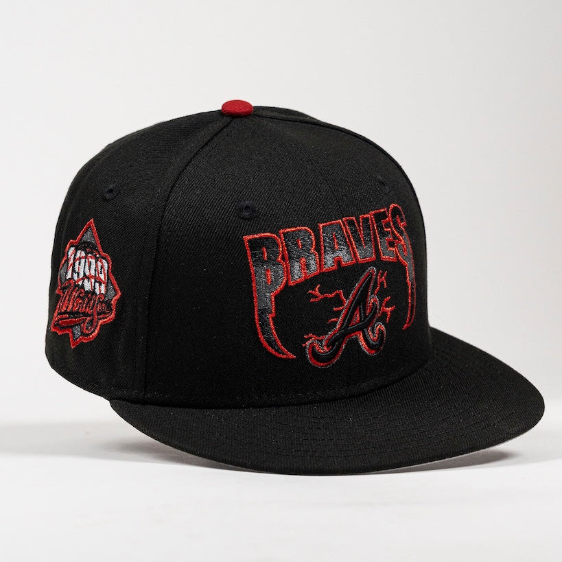 A black flat-brim baseball cap featuring distressed red and white embroidery with the Atlanta Braves 'A' logo on the front and a side patch.