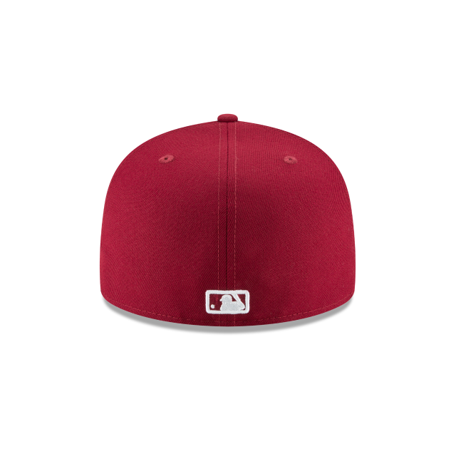 Red baseball cap with a logo on a white background