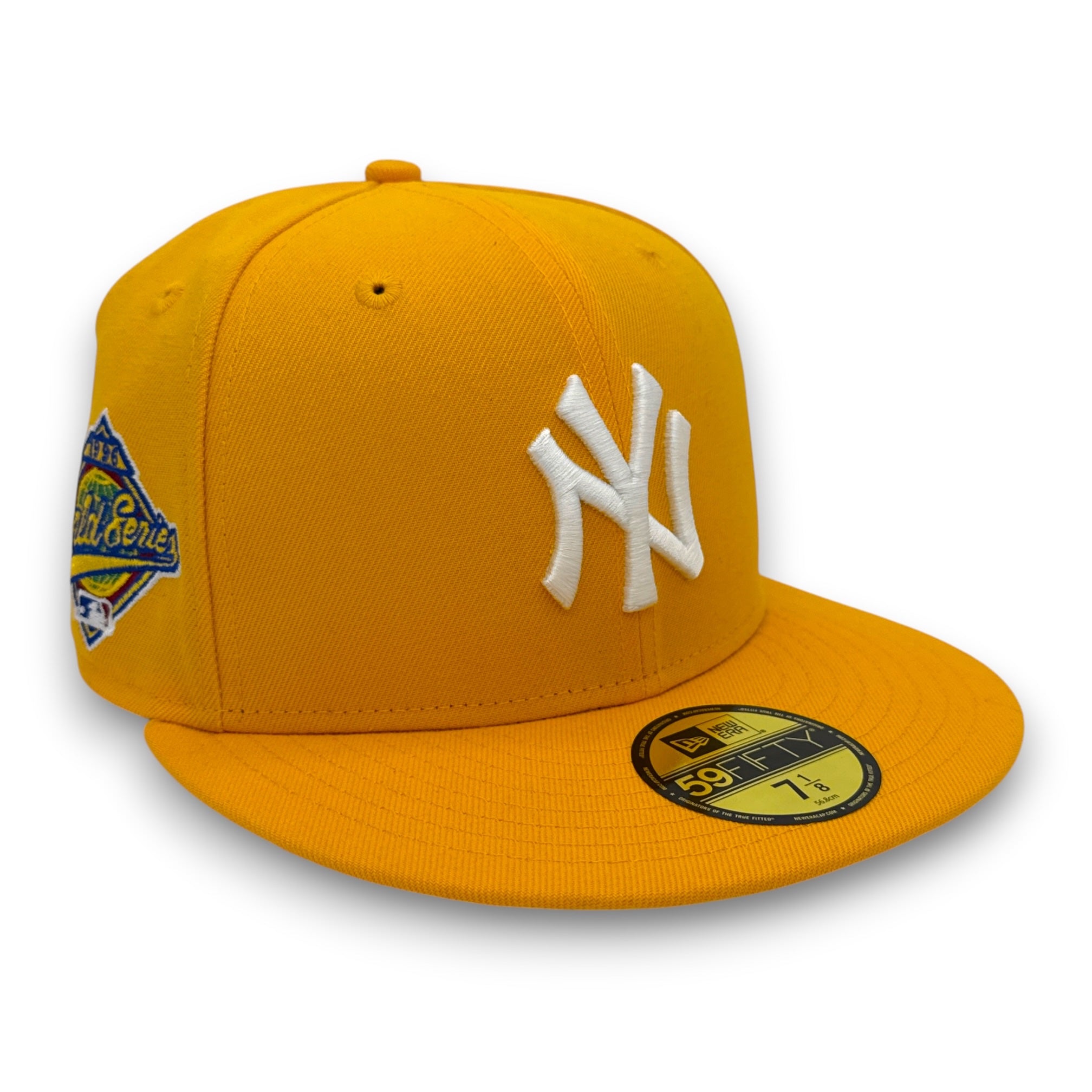 Yellow cap with white logo and patch on a white background