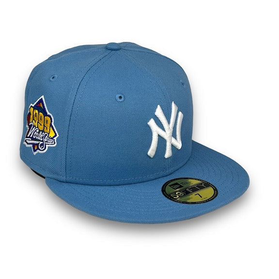 Blue baseball cap with New York Yankees logo and championship patch on a white background