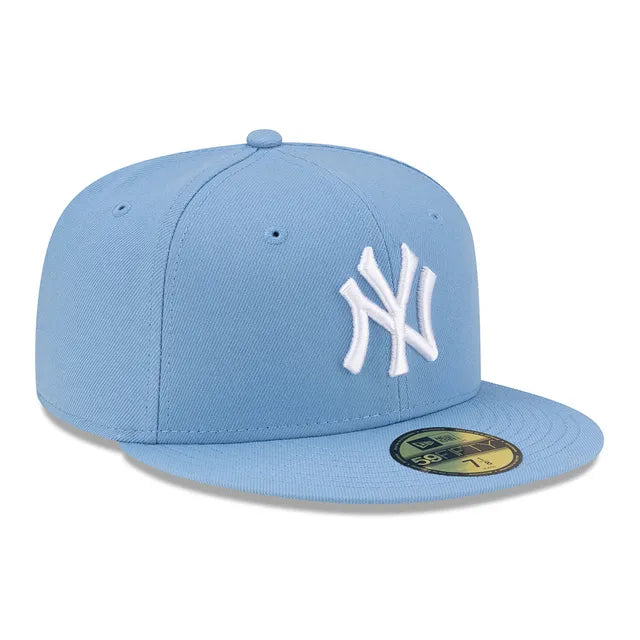 Light blue baseball cap with white logo on a white background
