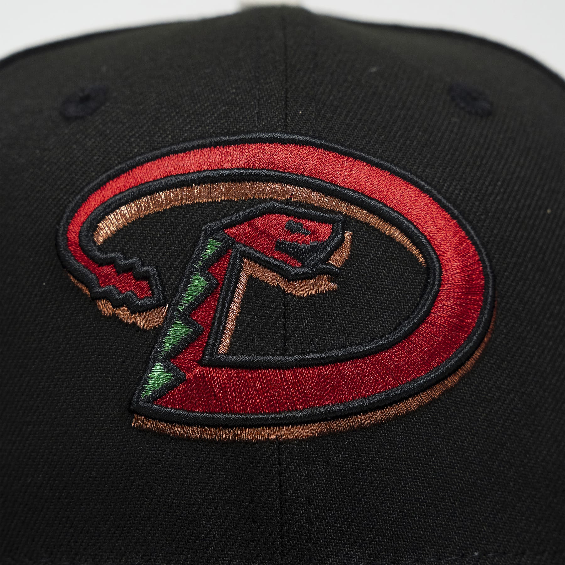 Black cap with a colorful logo on a white background- The Pirates Dbacks 98 59FIFTY Black New Era Hat