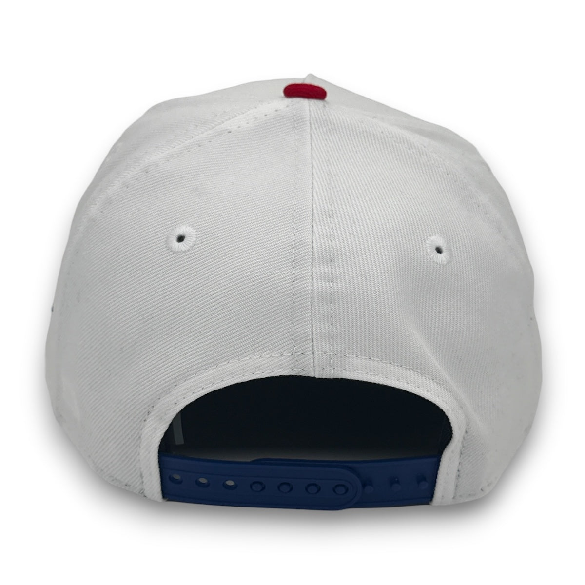 Back view of a white cap with a blue brim on a white background