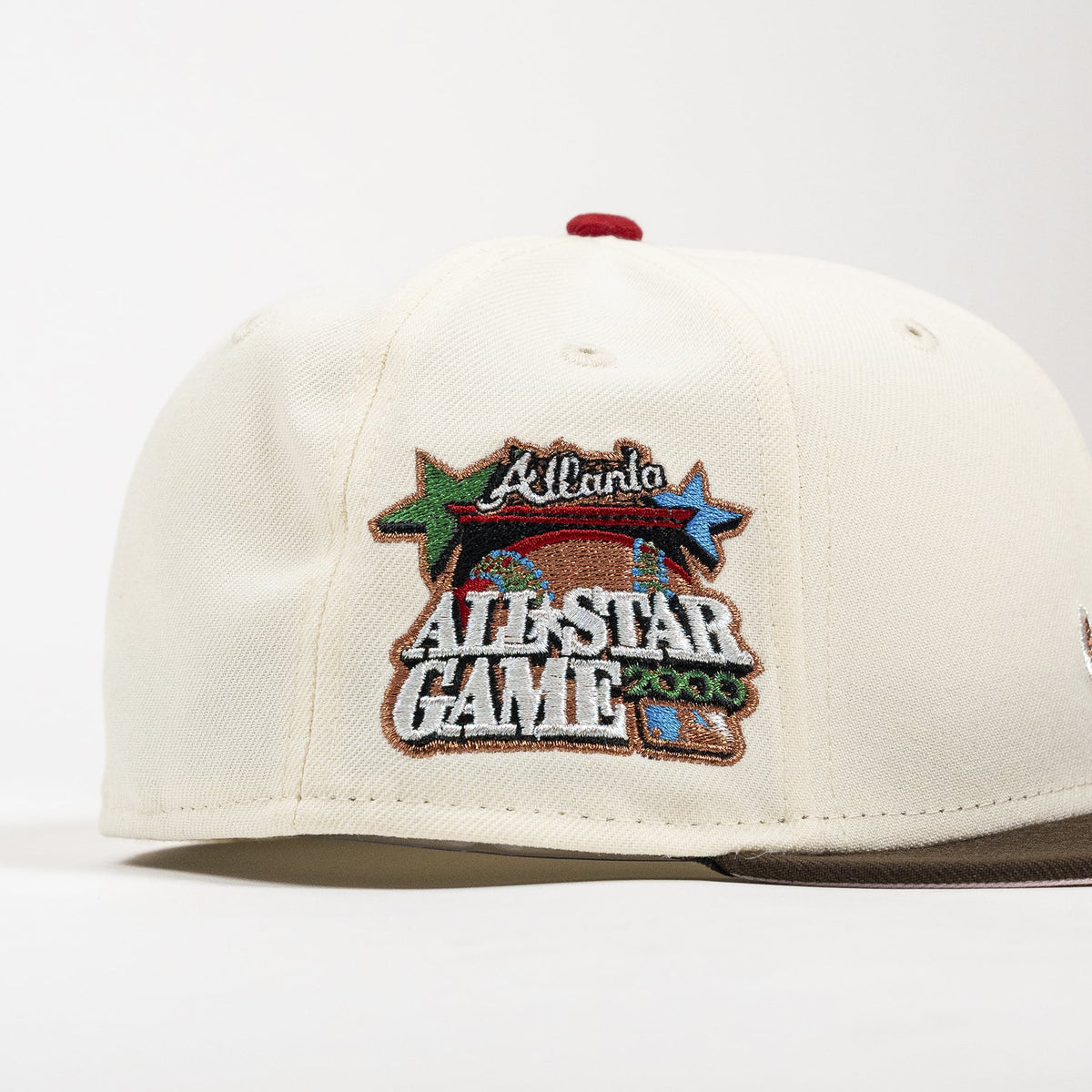 An off-white structured baseball cap featuring a prominent embroidered patch on the front that reads 'Atlanta All-Star Game 2006' with a football and stars, photographed against a clean white background.