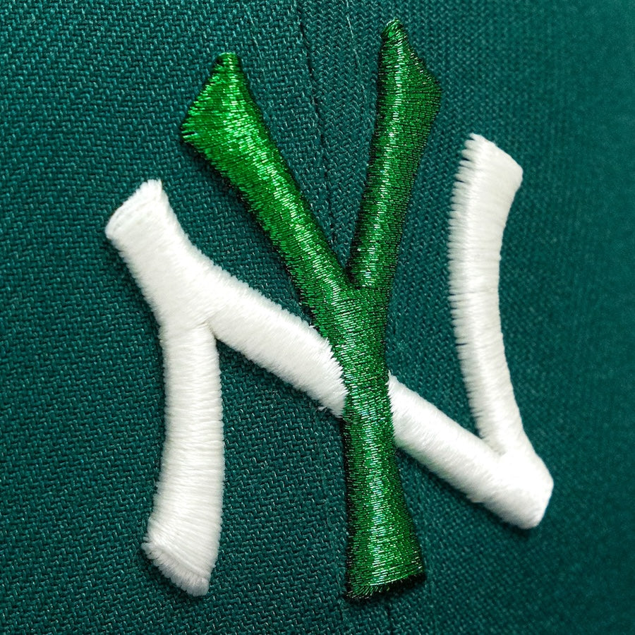 Embroidered logo on a green fabric background