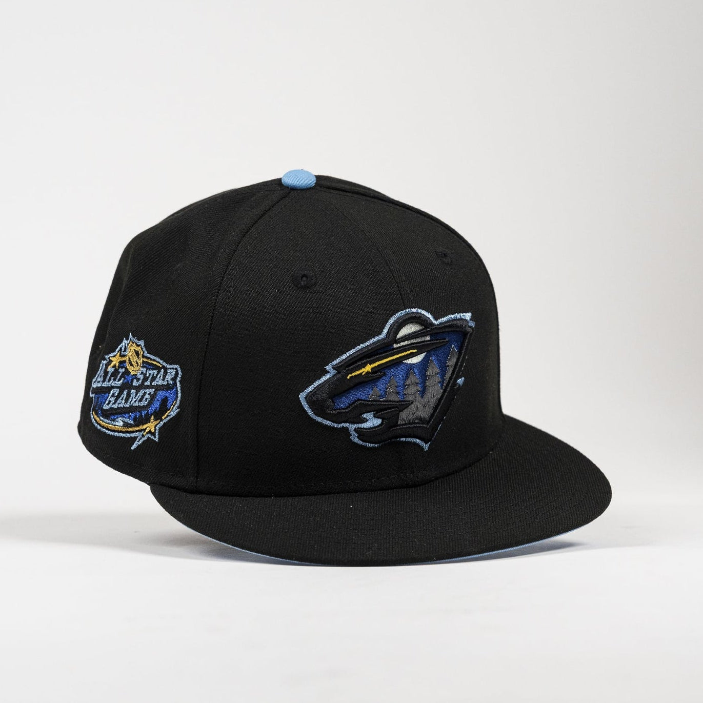 A black flat-brim baseball cap featuring an embroidered Minnesota Wild logo on the front and an All-Star Bangers patch on the side, set against a plain light gray background.