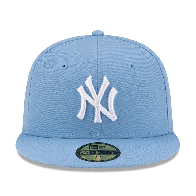 Light blue baseball cap with white logo on a white background