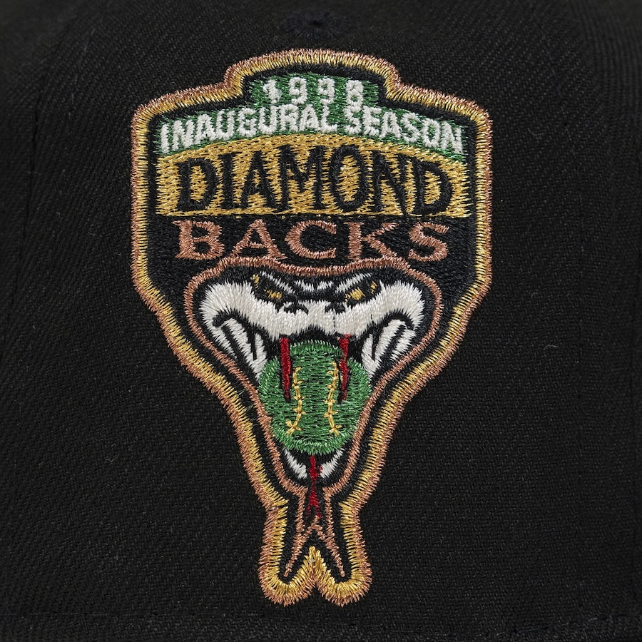 Embroidered patch on a black background with '1998 Inaugural Season Diamondbacks' text and snake design. The Pirates Dbacks 98 59FIFTY Black New Era Hat