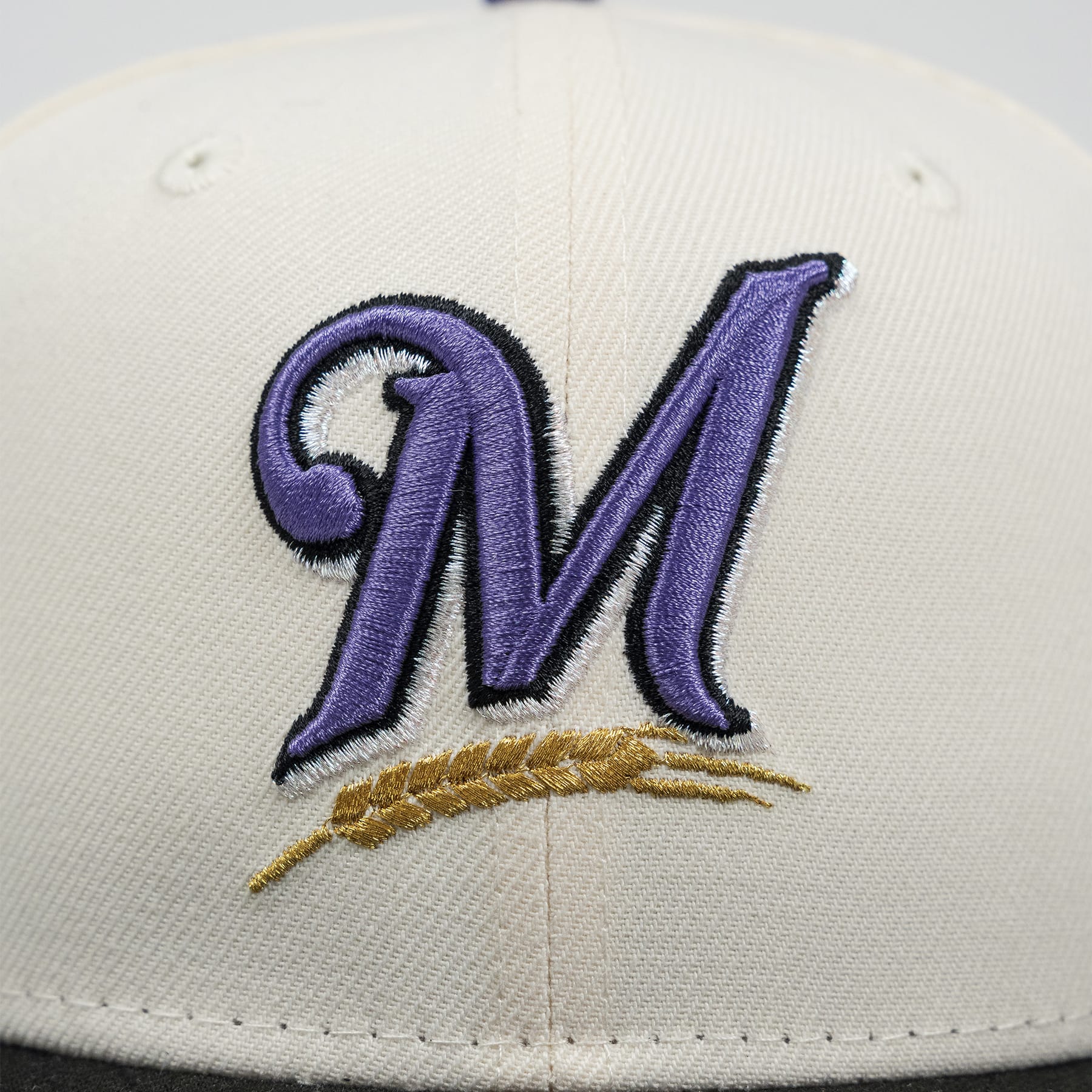 Baseball cap with a purple 'M' logo on a white background The Pirates Expos 02 ASG 59FIFTY Brick New Era Hat